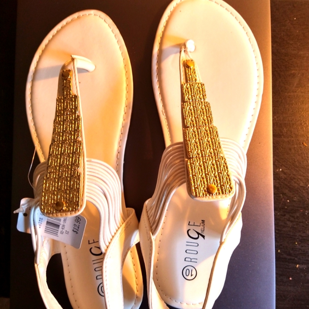 White thong sandals with gold trimming.